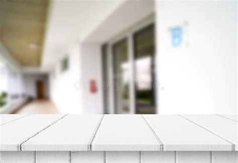 Wood White Table Top On Blur Building Hall Background Form Office
