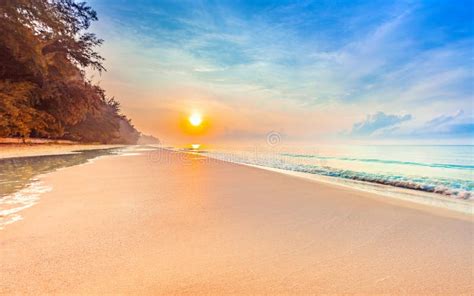 Beautiful Sunrise On The Tropical Beach With A Little Waves Stock Image
