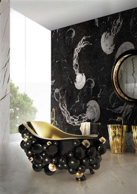 A Black And Gold Bathtub In The Middle Of A Room Next To A Mirror