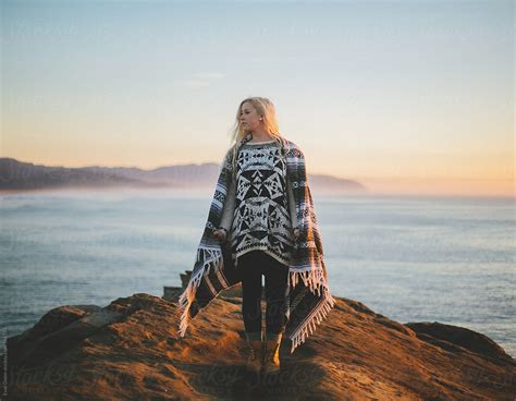 Young Blonde Woman On Coastal Cliff By Stocksy Contributor Evan Dalen Stocksy