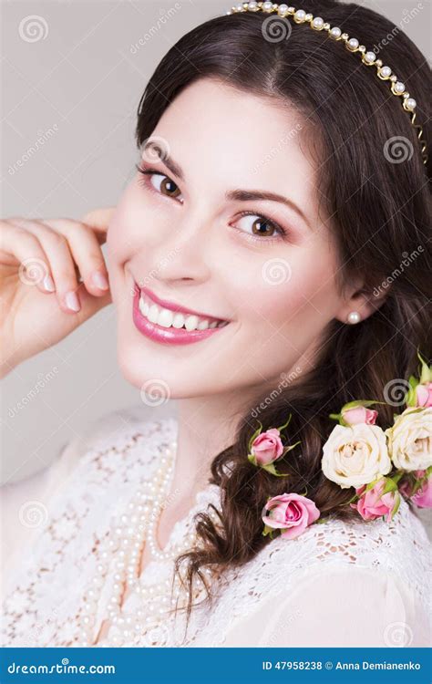 Beautiful Brunette Bride Smiling With Natural Make Up And Flowers Roses