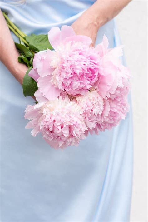 Bride In A Blue Wedding Dress With A Bouquet Of Pink Peonies Pastel