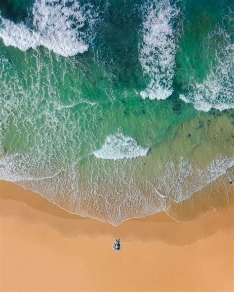Free Photo Aerial Drone Shot Of Beautiful Sand Beach With Turquoise