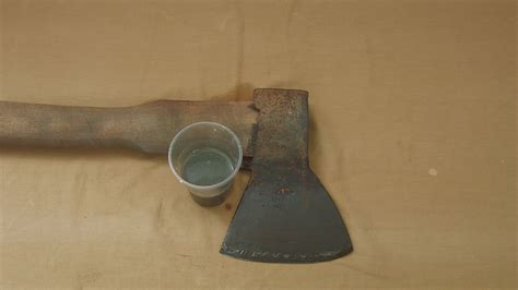 Place the stone on the ground. How to Sharpen an Axe: 12 Steps (with Pictures) - wikiHow