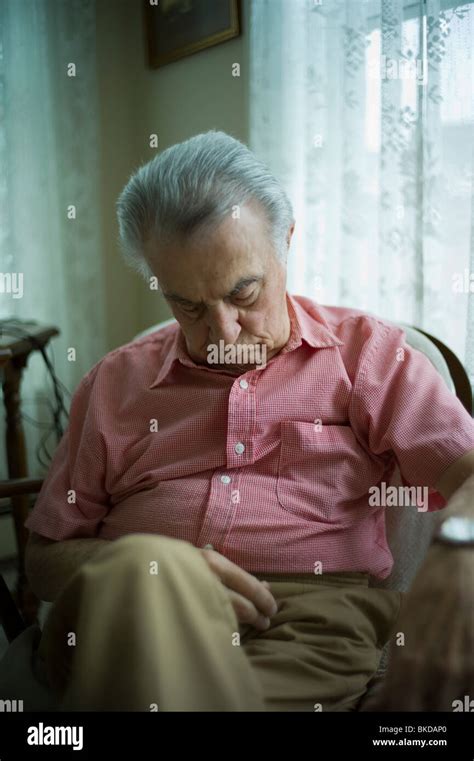 Old Man Sleeping In Living Room Chair Stock Photo Alamy