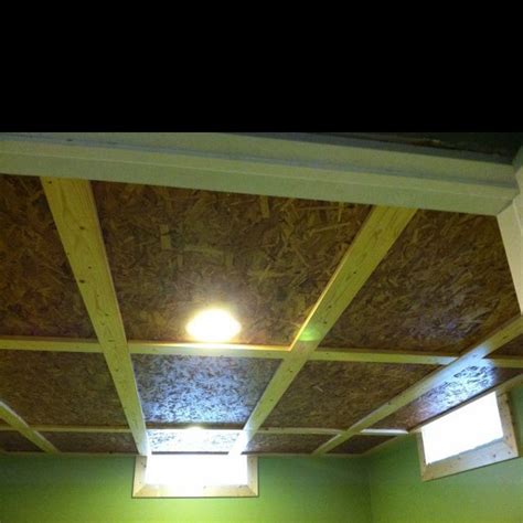 In some homes, there are wood beams already in the basement. new ceiling in basement | Basement lighting, Basement ...