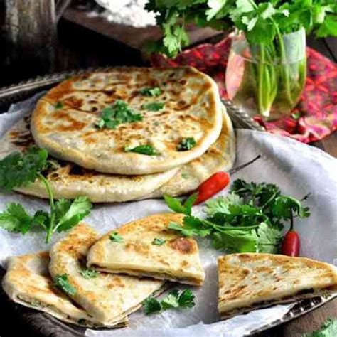 Aloo Paratha Indian Potato Stuffed Flatbreads Filled With Mashed