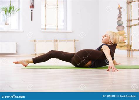 Beautiful Yogi Woman Practices Yoga Lying Asana Eka Pada Sirsasana