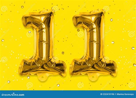 The Number Of The Balloon Made Of Golden Foil The Number Eleven On A