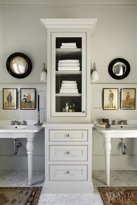 Sink cabinets for bathroom are very popular among interior decor enthusiasts as they allow for an added aesthetic appeal to the overall vibe of a these sink cabinets for bathroom also come in unique colors, shapes and sizes, all while effortlessly maintaining sync with every possible type of. double pedestal sinks with tall cabinet in between for ...