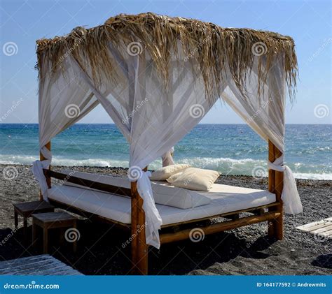 Luxurious Canopy Bed On Kamari Beach Royalty Free Stock Image