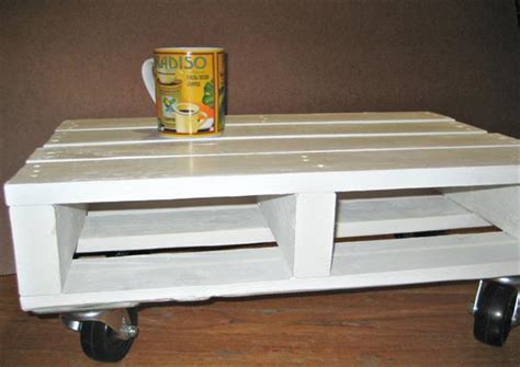 It has hidden casters for easy moving. DIY Pallet White Coffee Table with Casters | Pallet ...