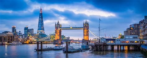 London Tower Bridge And The Shard Illuminated Over Thames Panorama