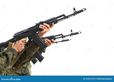 Three Military Machine Gunners Aim and Shoot. Light Background Stock