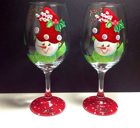 snowmen who doesn t love them live is the word on this wine glass these adorable snowmen have