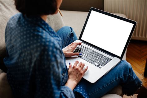 Cropped Image Of Woman Using Laptop With Blank Screen Stock Photo ...