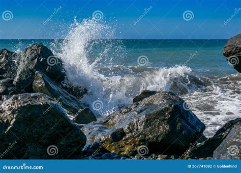 Splashing Big Wave Crashing Into The Rocks In The Rough Wild Water Of