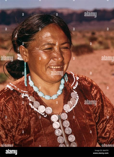 1950s Native American Navajo Indian Woman Wearing Hand Made Jewelry And Dress Adorned With