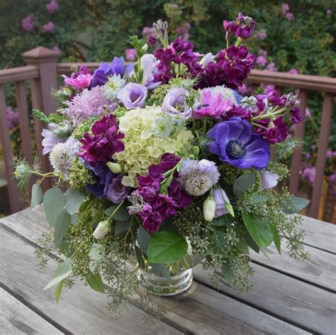 Centerpieceflower Arrangement In Purple Lavender And Fuchsia Colors