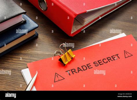 Papers With Trade Secret And A Red Folder Stock Photo Alamy