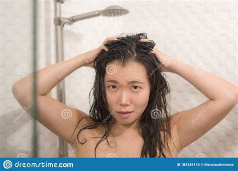 Young Beautiful And Happy Asian Korean Woman Taking A Shower In The Bathroom Washing Her Hair