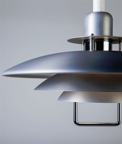 A Large Metal Light Fixture Hanging From A Ceiling