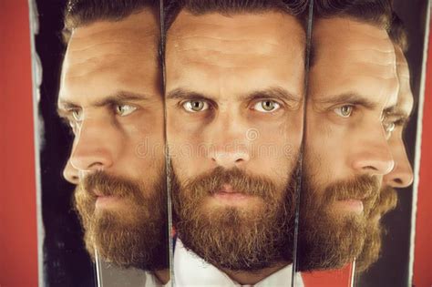 Face Of Serious Bearded Hipster Man Businessman Reflecting In Mirror