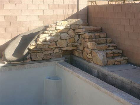 Create A Beautiful Natural Stone Water Feature For Your Swimming Pool