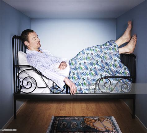 Man Sleeping In Small Bed Room Side View Bildbanksbilder Getty Images