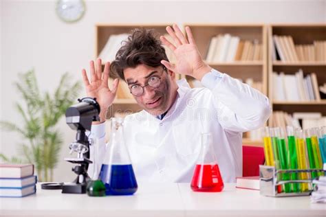 The Mad Crazy Scientist Doctor Doing Experiments In A Laboratory Stock