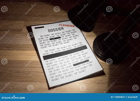 Classified and Top Secret Dossier with Redactions in a Spotlight