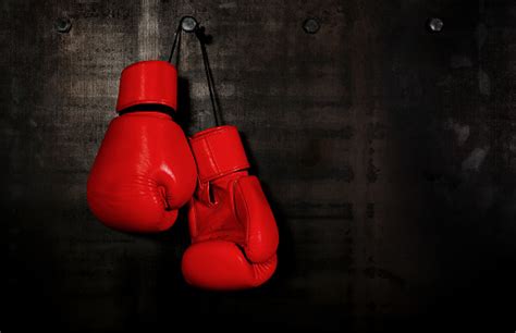 Red Leather Boxing Gloves Hanging On Black Wall Stock Photo Download