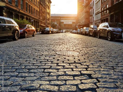 Old Cobblestone Street With Cars Parked Along The Curb In The Tribeca