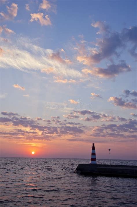 Beautiful Sea Sunrise And Lighthouse On Pier Stock Photo Image Of