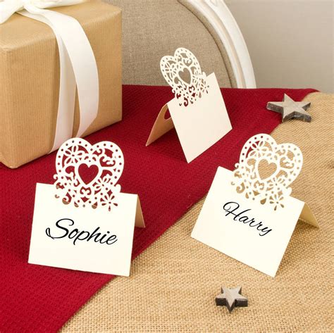 Want to make your guests feel more special and at the same time keep your event organized and running smoothly? set of 10 paper heart name place cards by dibor | notonthehighstreet.com