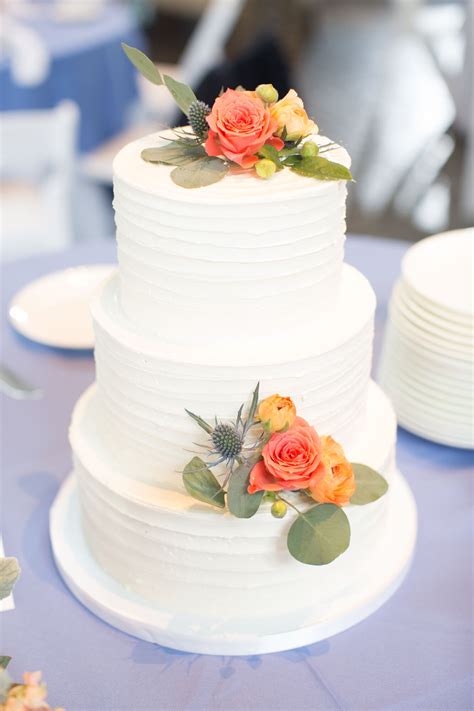 Buttercream Wedding Cake With Coral Roses