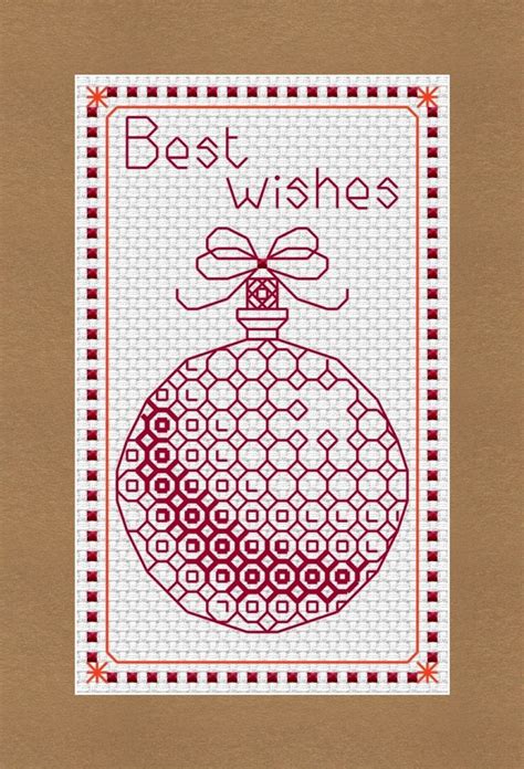 a cross stitch christmas ornament with the words best wishes written in red on it