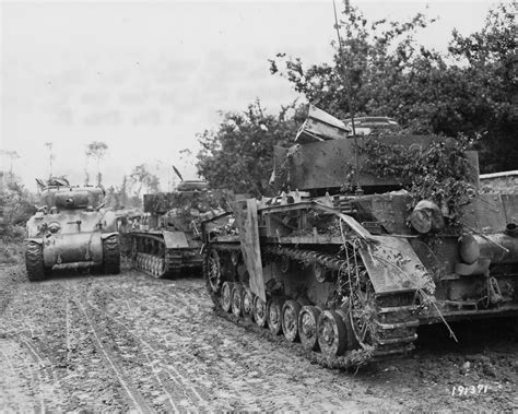 M4a1 Sherman Of The 30th Infantry Division Passes Two German Panzer Iv
