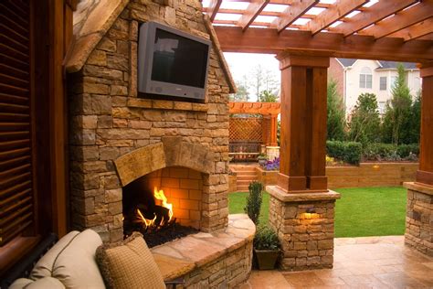 Outdoor Stacked Stone Fireplace With Tv Mount With Attached Pergola