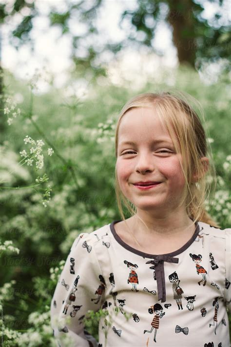 A Little Girl Giggling By Stocksy Contributor Helen Rushbrook