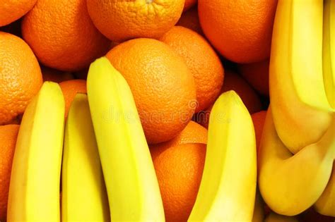 Oranges And Bananas Background From Oranges And Bananas Fruits Stock