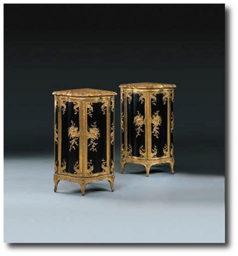A pair of lacquered wooden corner cabinets, 