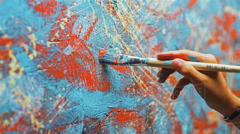 Close Up Shot Of Female Artist Hand Holding Paint Brush And Drawing