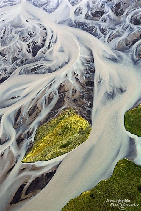 Aerial Image Of A Green Island In An Icelandic River Aerials