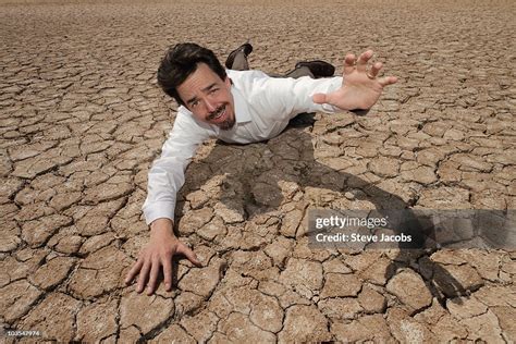 Thirsty Man In Desert High Res Stock Photo Getty Images