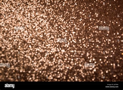 Abstract Background Of Bronze Glitter Sparkling In Defocused Bokeh