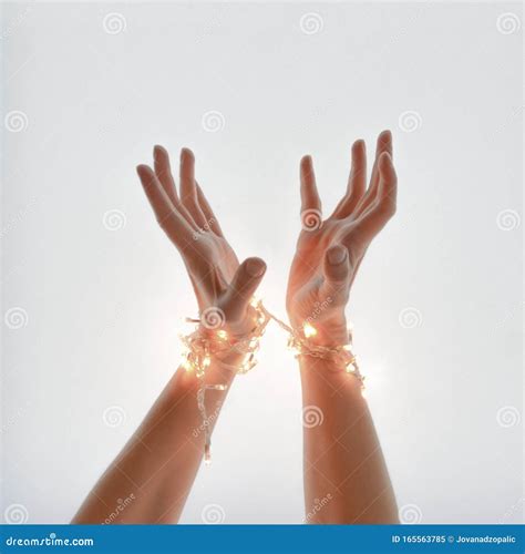 Close Up Of Woman Hands Wrapped In New Year S Light Gesture Of Getting