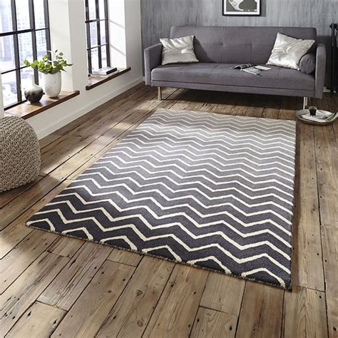 Enhance the cosy appeal of your bedroom with a big, luxurious rug beneath your bed. Zago Rug | Grey and white rug, Rugs uk, Grey bedroom rug