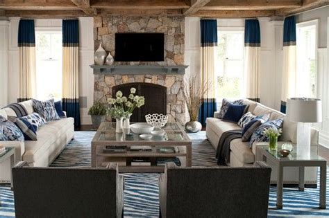 A pair of louis xvi armchairs sit opposite the sofa, with a trunk as a coffee table in between. Why You Should Arrange Two Identical Sofas Opposite Of ...