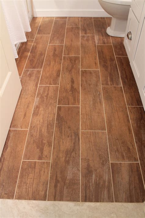 Tile manufacturers are keeping up with the times and following the trends of 2021 bathroom flooring trends: Remodelaholic | Bathroom Renovation with Wood Grain Tile ...